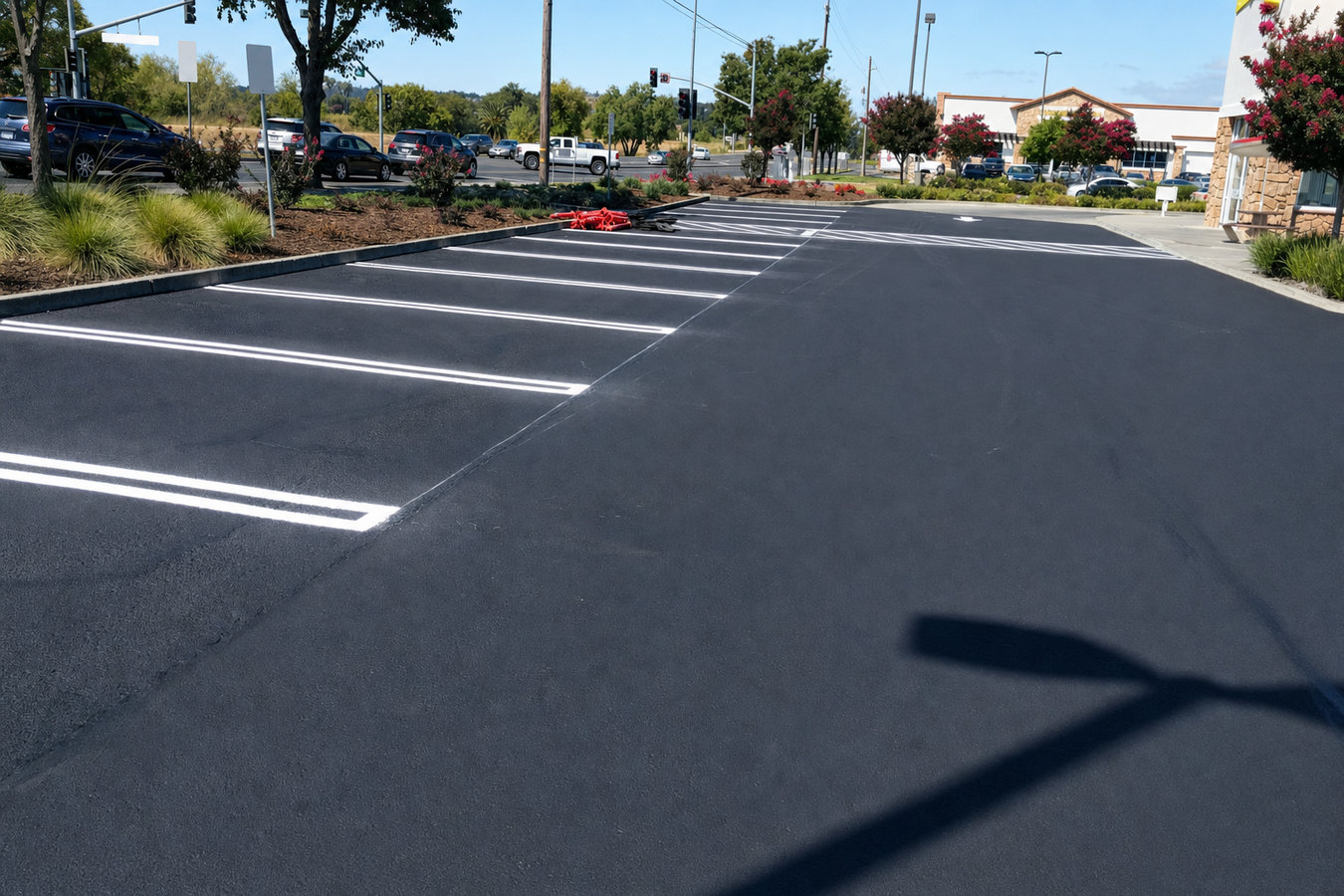 Asphalt sealcoating